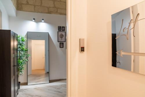 a hallway with a door leading into a room at Loft Rooms Suite B&B in Santeramo in Colle