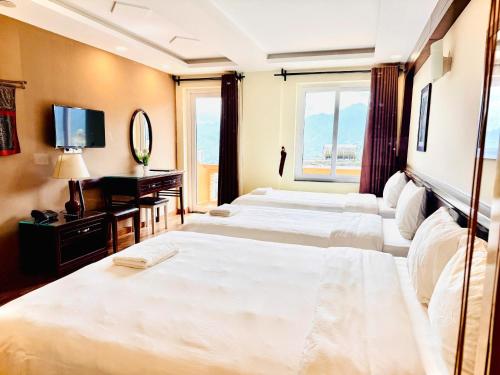 Ένα ή περισσότερα κρεβάτια σε δωμάτιο στο Cat Cat View Hotel