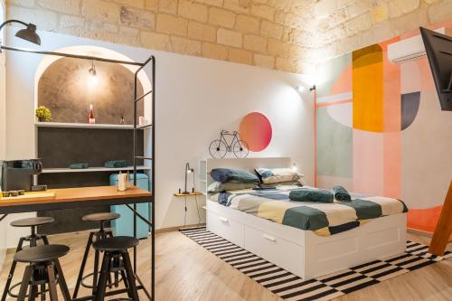 Ένα ή περισσότερα κρεβάτια σε δωμάτιο στο Loft Rooms Suite B&B