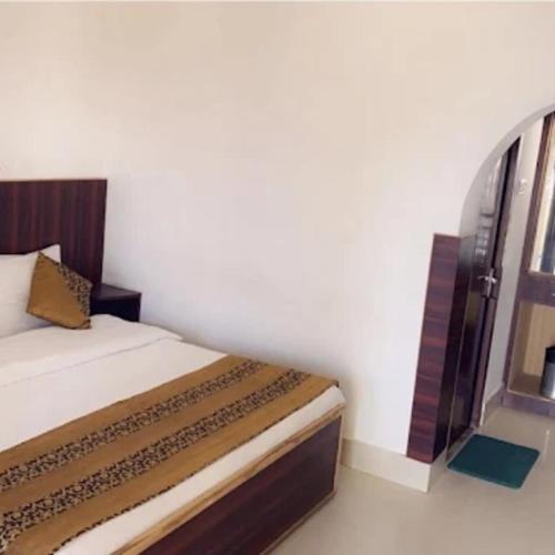 a small bedroom with a bed and a window at Suncrest Trails Resort in Lansdowne