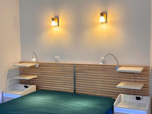 a room with two sinks and two lights on the wall at Appartement scandinave rénové, skis aux pieds, 7 pers. - FR-1-634-6 in Avoriaz