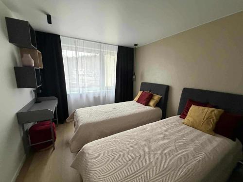 Two Bedroom Apartment LAZDYNAI 객실 침대