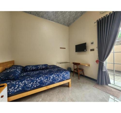 Postel nebo postele na pokoji v ubytování OYO 94924 Cidu Homestay Syariah