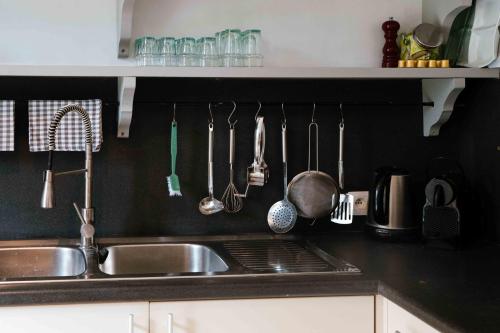 Una cocina o cocineta en Le Paddock by Ernesst