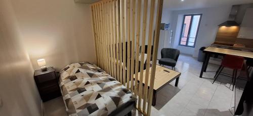 Postel nebo postele na pokoji v ubytování Le 4 - Coeur de ville