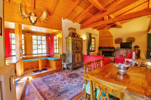 a living room with a table and a dining room at Holiday home in Campo Carlo Magno 24162 in Madonna di Campiglio