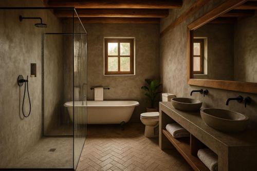 a bathroom with two sinks and a bath tub at Serokan The Anami in Cai Be