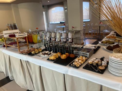 a table with a buffet of food on it at Mareneve Resort in Linguaglossa