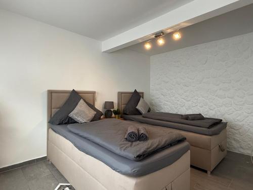 a bedroom with two beds in a room at Apartment Mira 12 in Pulheim