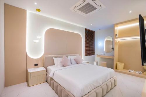 Postel nebo postele na pokoji v ubytování Paco Villa Pattaya