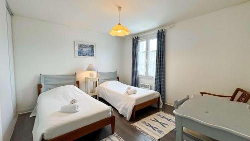 Postel nebo postele na pokoji v ubytování Charmante location à quelques pas du port et des restaurants