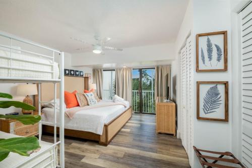 a bedroom with a bunk bed and a balcony at Saltwater Lagoon Front View, Marina, Kayaks in Key Largo