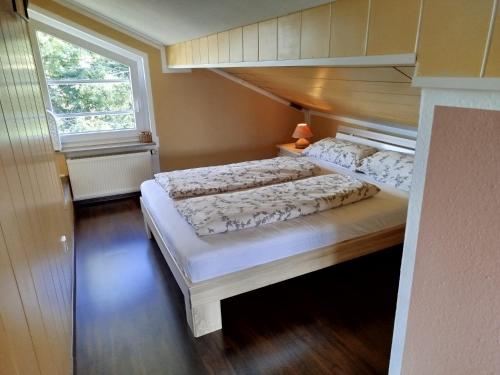 a large bed in a room with at Haus am Aartalsee in Bischoffen