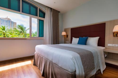 Ένα ή περισσότερα κρεβάτια σε δωμάτιο στο Phú Quốc Grand Fortune Hotel