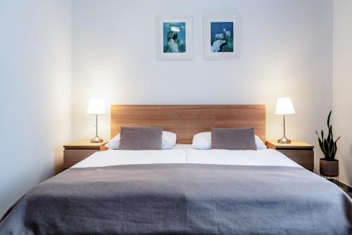 Ένα ή περισσότερα κρεβάτια σε δωμάτιο στο Petit Dependance