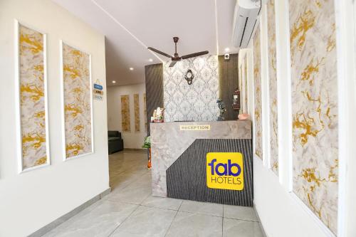 a lobby with a job horizons sign on the wall at FabHotel AB Residency in Ludhiana