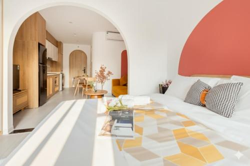 a living room with a white couch and a table at Label6 To Ngoc Van - Crescendo Boutique Studio in Hanoi