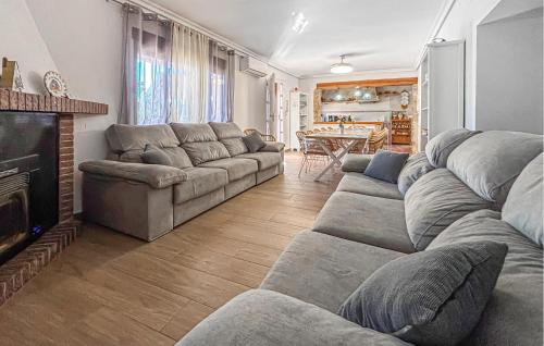 a living room with a couch and a fireplace at Stunning Home In Mula in El Niño