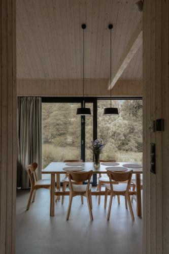a dining room with a table and chairs at Wood Rest, MyWeek in Stronie Śląskie