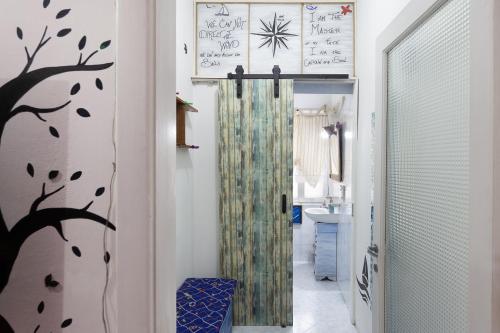 a hallway with a shower in a bathroom at San Francesco Lodge&Art Hostel in Trieste