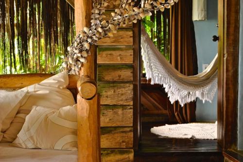 En eller flere senge i et værelse på Shangri-lá Pousada na praia em Itacaré