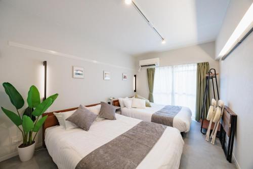 Postel nebo postele na pokoji v ubytování Nagoya15min-Nagoya Castle-Free P