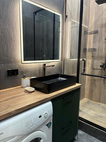 Ένα μπάνιο στο Квартира Арена Таурес