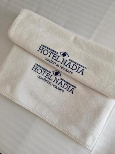 a towel with the words hotel nada on it at Hotel Nadia Eforie Nord in Eforie Nord