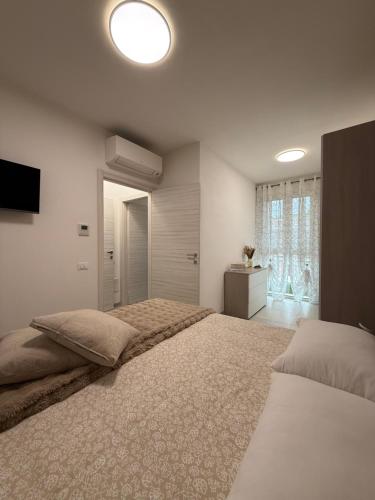 Ένα ή περισσότερα κρεβάτια σε δωμάτιο στο soffio del mar