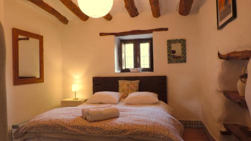 a bedroom with a bed with two pillows on it at Brisa in Oria