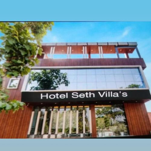 a sign for a hotel serif villa at Hotel Seth Villas in Varanasi
