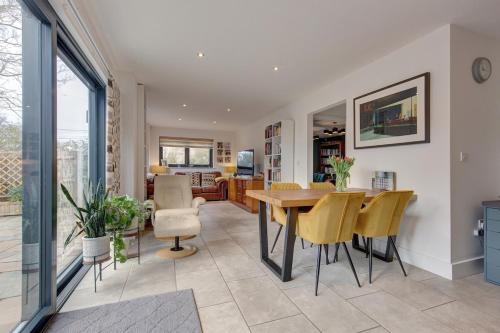 a kitchen and dining room with a table and chairs at Kim's Place in Hingham