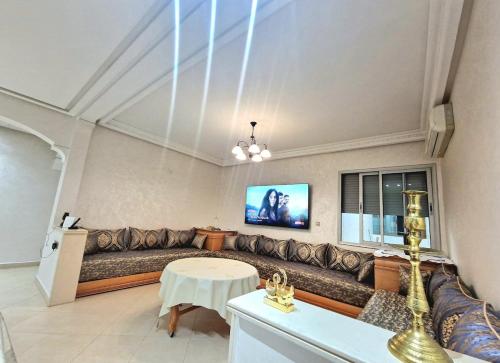 a living room with a couch and a table at Nobilium in Meknès
