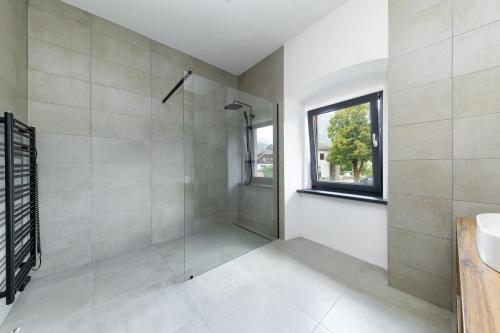 Ένα μπάνιο στο Rattendorf Luxury Apartments