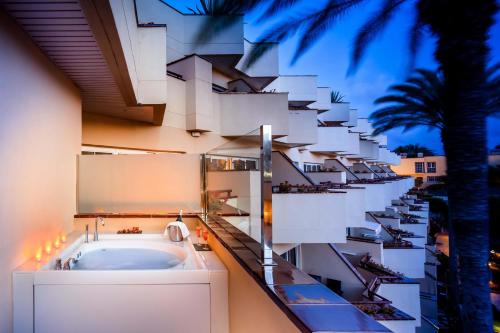 a building with a bath tub on the side of it at Barceló Corralejo Bay - Adults Only in Corralejo