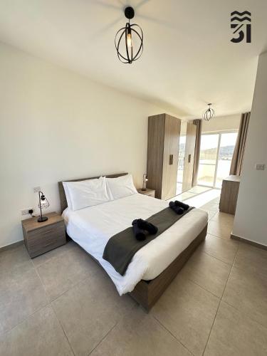 Ένα ή περισσότερα κρεβάτια σε δωμάτιο στο M31Stays - St Paul's Modern Apartments and Penthouse