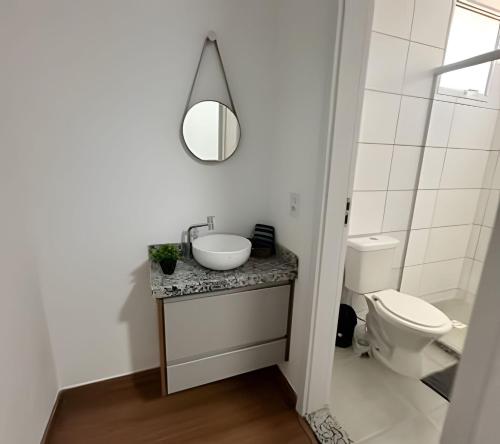 a bathroom with a sink and a toilet at Rose Prime Loft – Executive Apartment in Extrema in Extrema