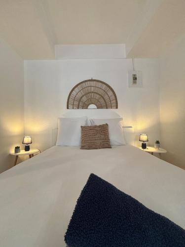 Ένα ή περισσότερα κρεβάτια σε δωμάτιο στο Le Cocon Central avec Balnéo