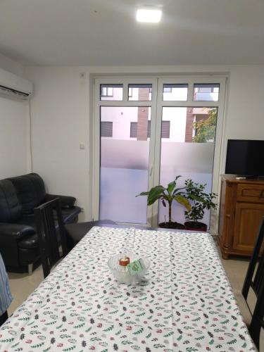 a table with a bowl of food on top of it at Pod kestenom in Vršac