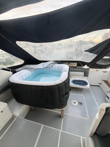 a hot tub on the back of a boat at Boat with Jacuzzi - Bateau avec Jacuzzi in Mandelieu-la-Napoule