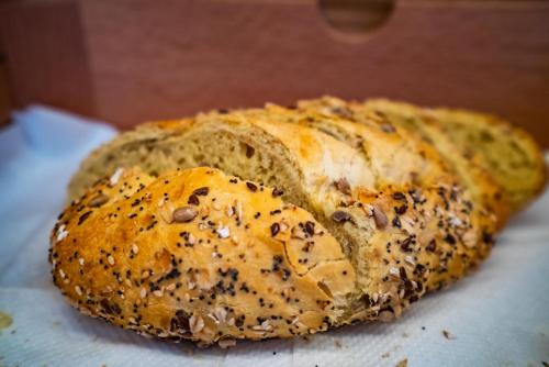 a loaf of bread sitting on a piece of paper at Smartr Sevilla Puente de Triana in Seville