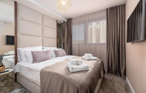 a hotel room with a bed with towels on it at Val di Bora in Poreč