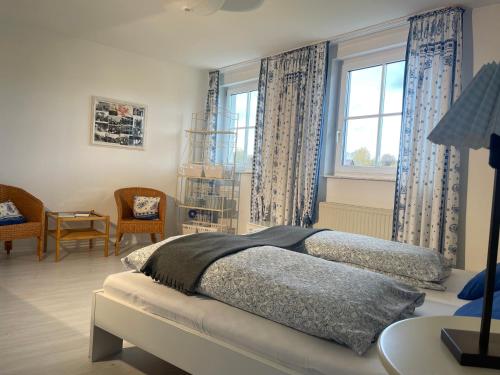 a bedroom with a bed and a window at Ferienidyll Aumühle "Muswiese" in Rot am See