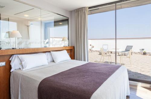 Postel nebo postele na pokoji v ubytování Hotel Don Paco