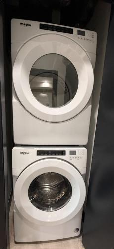 a washing machine and a washer and dryer at Spotless vibrant & modern 1 BR with 6 appliances in Halifax