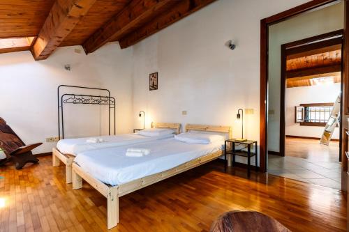 a bedroom with a large bed in a room at Elegant Attic-Rovigo Center-6 people in Rovigo