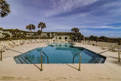 a large swimming pool with chairs around it at SC304A: 304A Sea Cabin in Isle of Palms