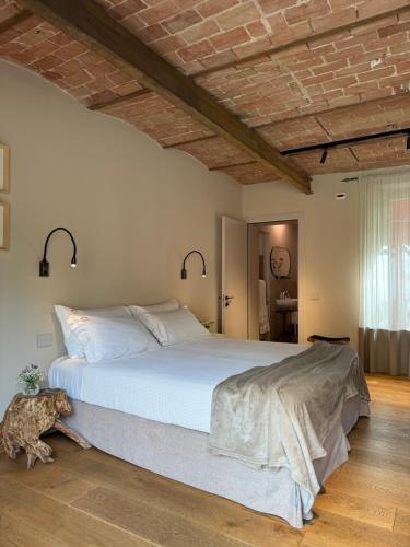 Postel nebo postele na pokoji v ubytování Tenuta Pizzone Wine Resort