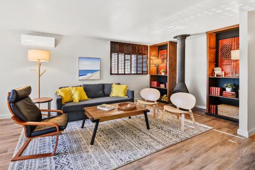 a living room with a couch and a table at Seashore Delight in San Diego