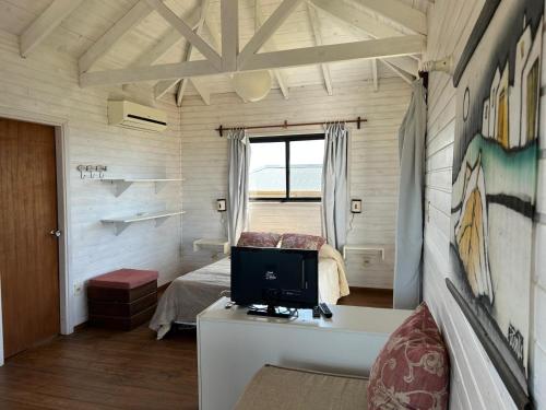 Postel nebo postele na pokoji v ubytování Cabañas Utopía